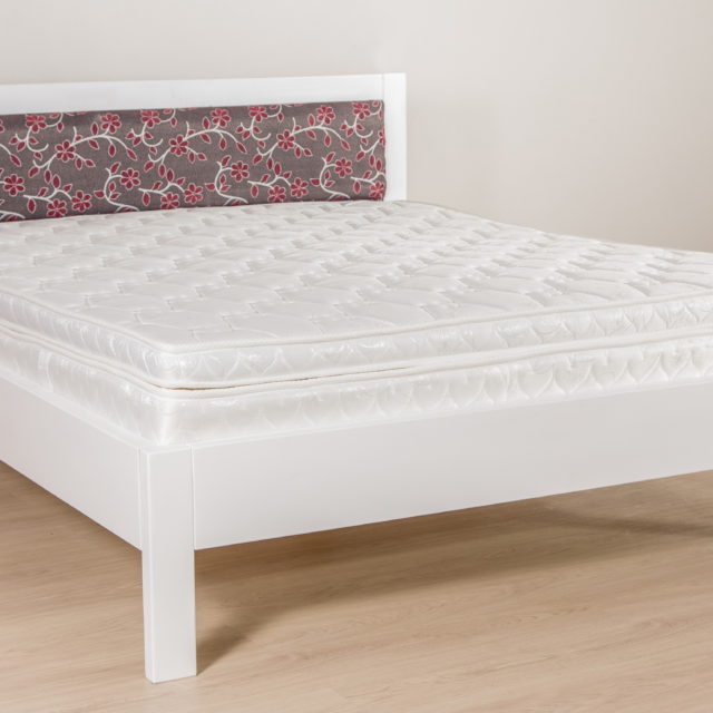 Double bed with upholstery